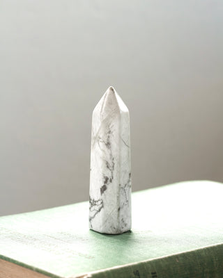 Marbled howlite stone obelisk.