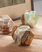 Marble-like calcite stone blocks on a wooden surface