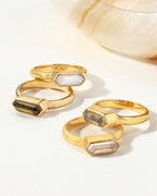 Gold Kaleidoscope rings with Green Tourmaline, Moonstone, Labradorite, and Clear Quartz gems.