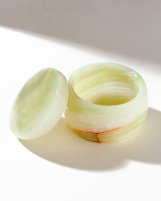 A jewelry box made of genuine calcite, with a lid, displayed on a white surface