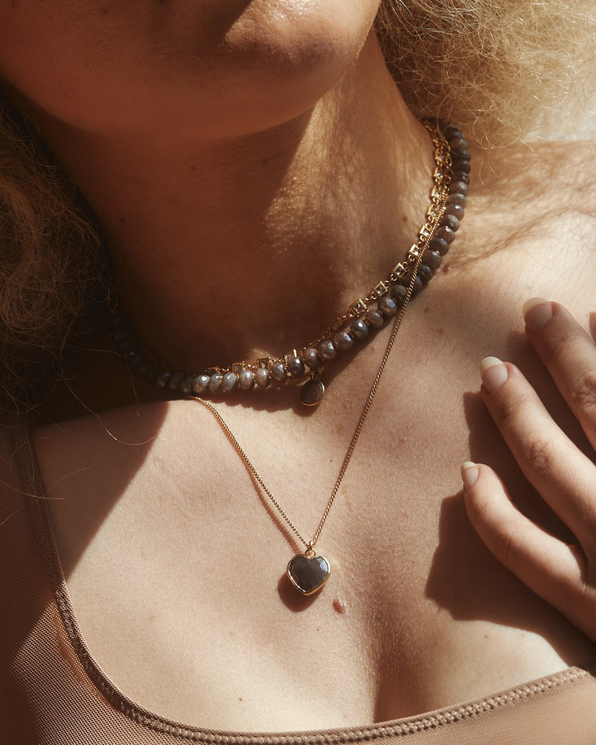 Model wearing Coffee Moonstone Conversation Heart Necklace