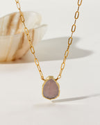 Gold chain necklace with a teardrop-shaped Coffee Moonstone pendant.