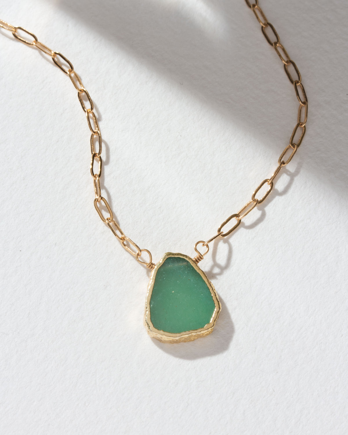 Gold chain necklace featuring a Green Aventurine gemstone pendant.