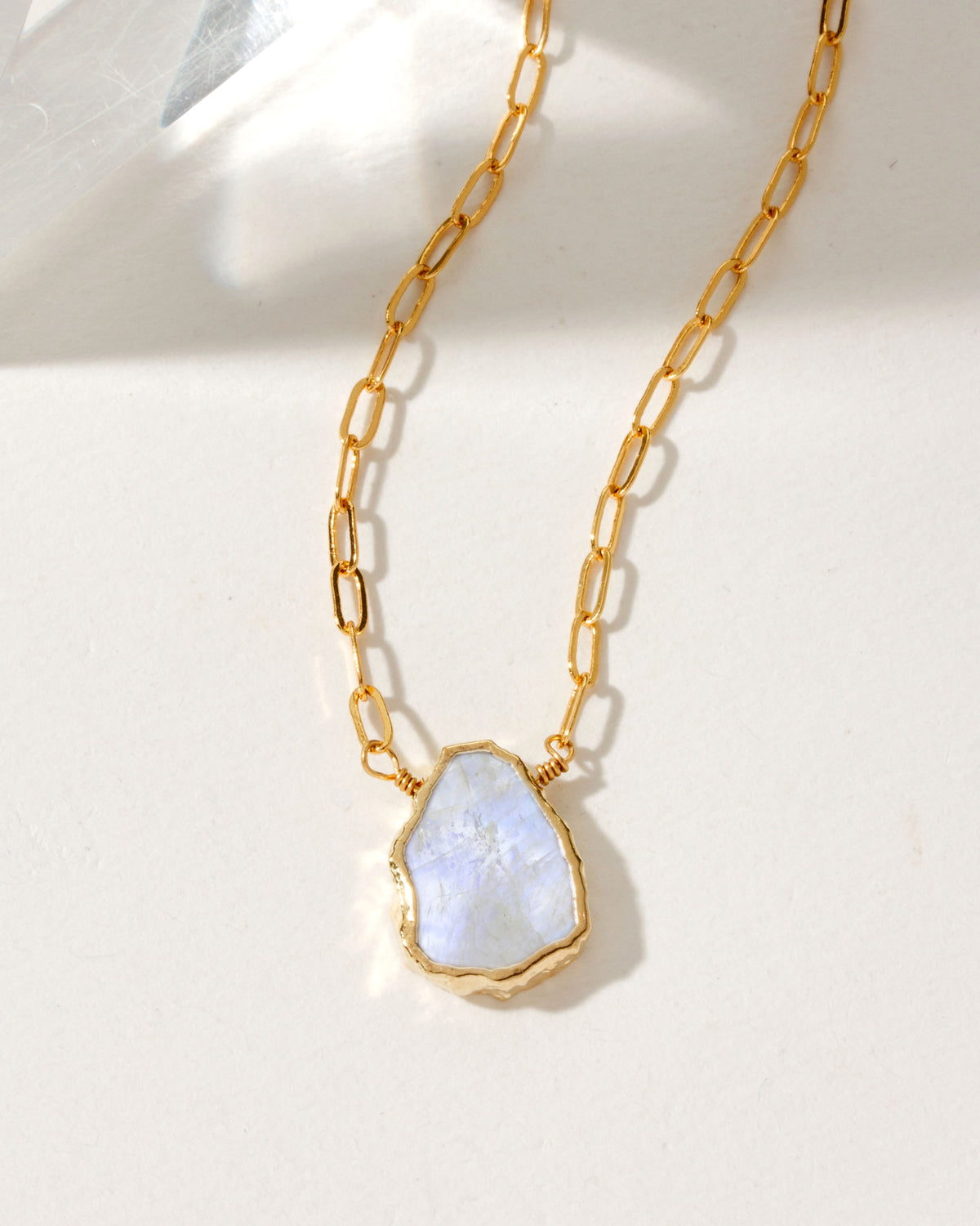 Elemental Force necklace with a Moonstone pendant and gold chain.