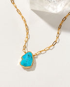 Gold chain necklace featuring a Turquoise gemstone pendant.