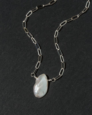 A silver paperclip chain necklace with  irregular Keshi pearl pendant.