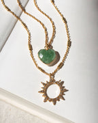 Two gold necklaces with green aventurine heart and sun-shaped pendants