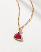 Detail of triangular ruby pendant necklace
