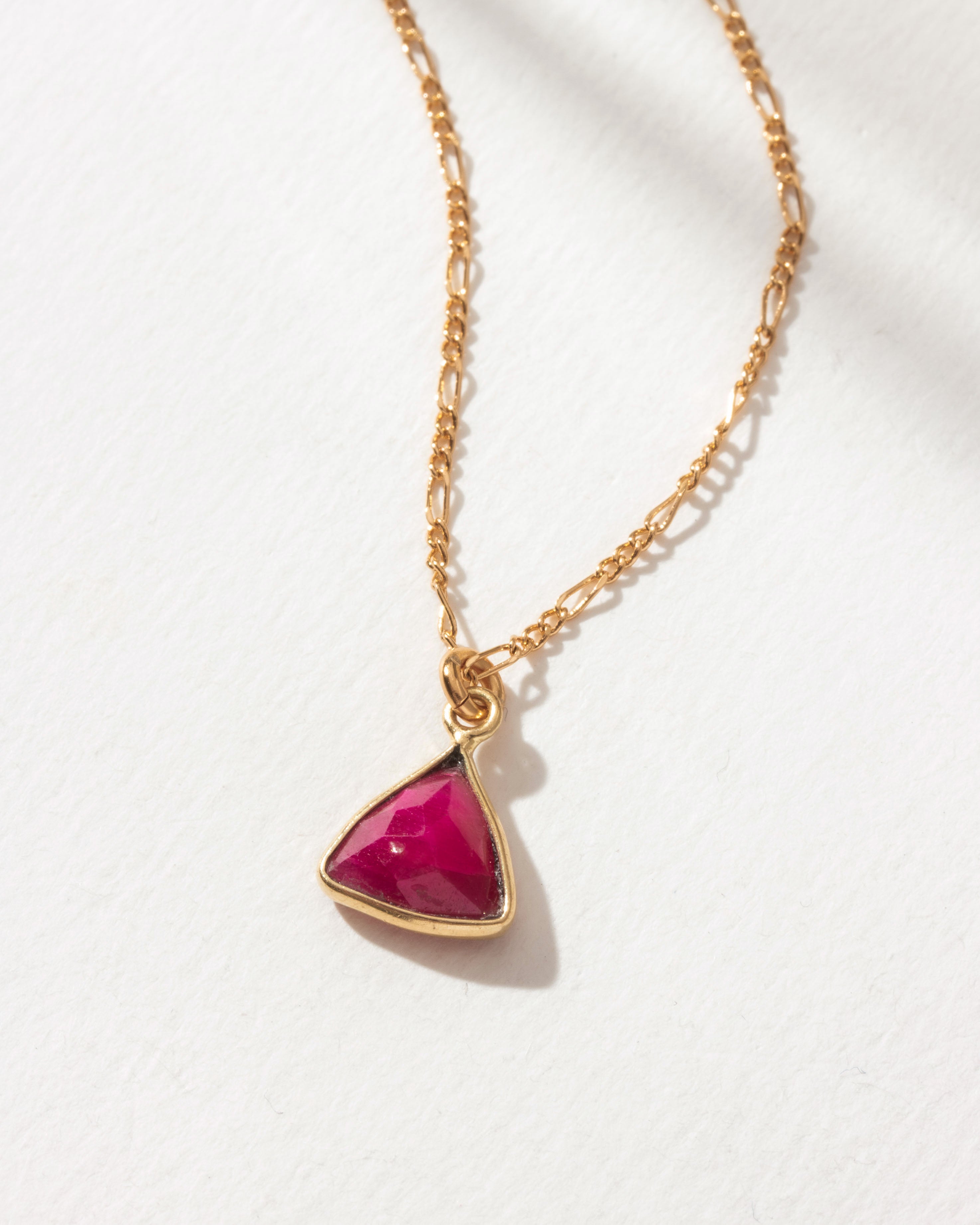 Detail of triangular ruby pendant necklace