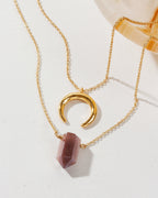 A layered necklace with a gold crescent moon charm and a Coffee Moonstone point pendant.