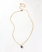 Gold chain necklace featuring a Sapphire heart-shaped gemstone pendant.