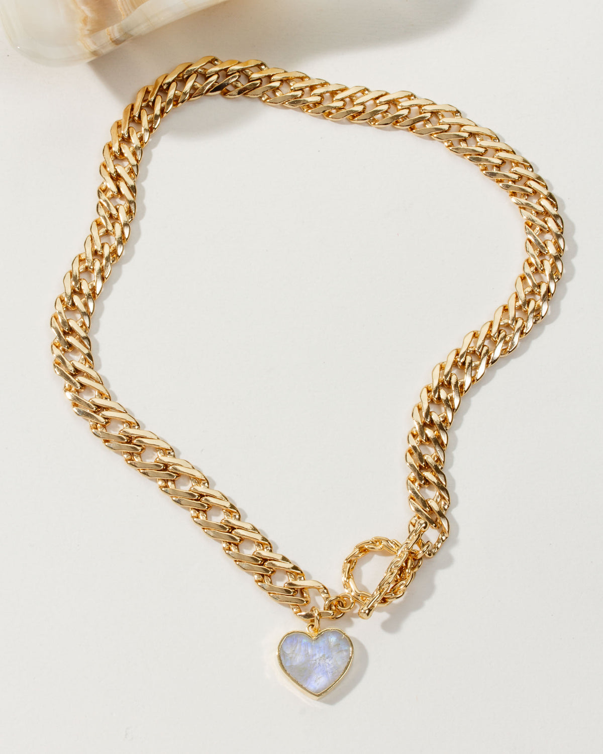 Gold chain necklace with a Moonstone heart pendant and a toggle clasp.