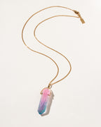 Necklace with a colorful pendant on a light beige background