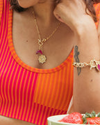 Woman wearing a gold Lunar Front Toggle Zodiac Necklace, Capricorn variant.