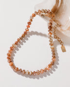 Java Jewel Beaded Collar Necklace in Peach Moonstone, featuring an adjustable gold chain.
