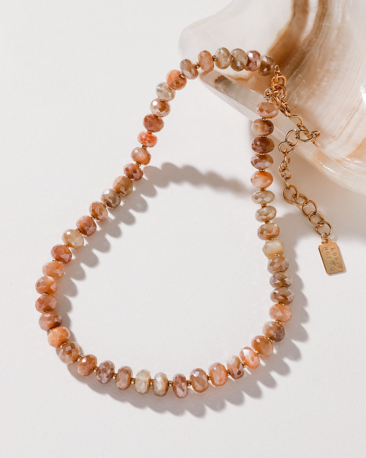 Java Jewel Beaded Collar Necklace in Peach Moonstone, featuring an adjustable gold chain.