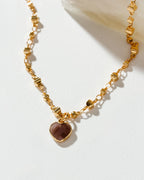 Gold necklace with a "coffee" moonstone heart pendant.