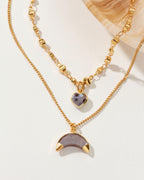 Two-layered gold necklace with a heart and crescent "coffee" moonstone pendant.
