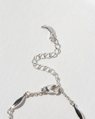 Close up of the clasp and extender chain of the silver Dolce Luna necklace.