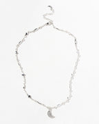 Silver 'Dolce Luna' necklace with a crescent gemstone pendant and star details.