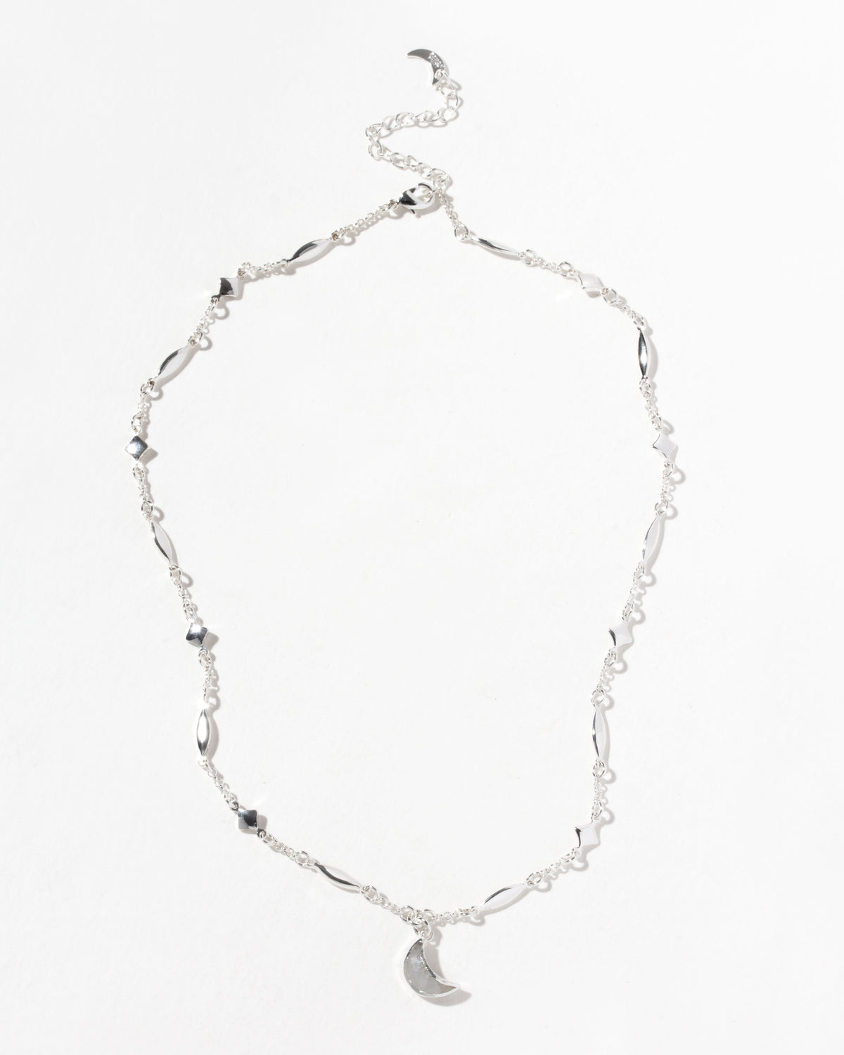 Silver 'Dolce Luna' necklace with a crescent gemstone pendant and star details.