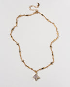 Gold celestial linked chain with Polaris gemstone star charm necklace.