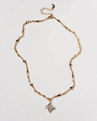 Gold celestial linked chain with Polaris gemstone star charm necklace.