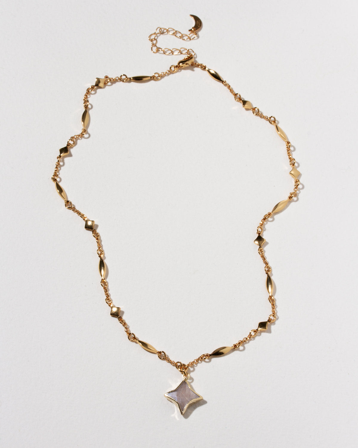 Gold celestial linked chain with Polaris gemstone star charm necklace.