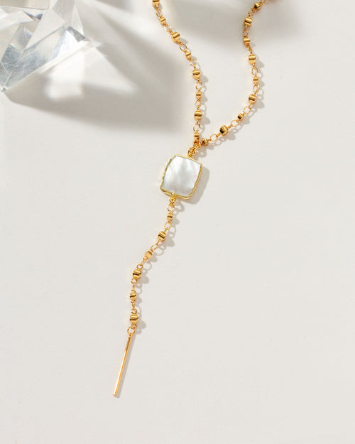 Gold Eterno Amore Gemma Lariat Necklace with Mother of Pearl pendant.
