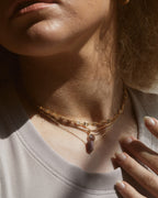 Neck view of a model wearing a Grid Spectrum CZ Collar Chain Layering Necklace.