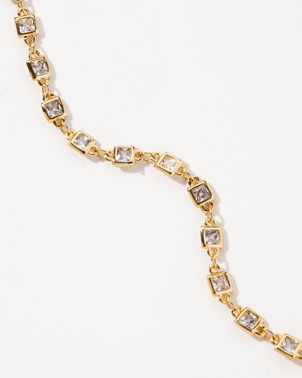 Gold chain necklace with square clear CZ stones.
