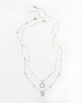 Full view of Silver Keshi pearl pendant necklace set with a CZ sun pendant and heart-shaped pearl on a white background