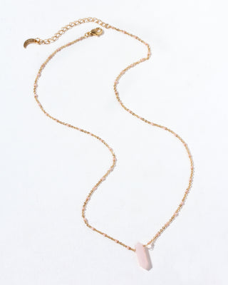 Necklace with a pink opal pendant on a white background