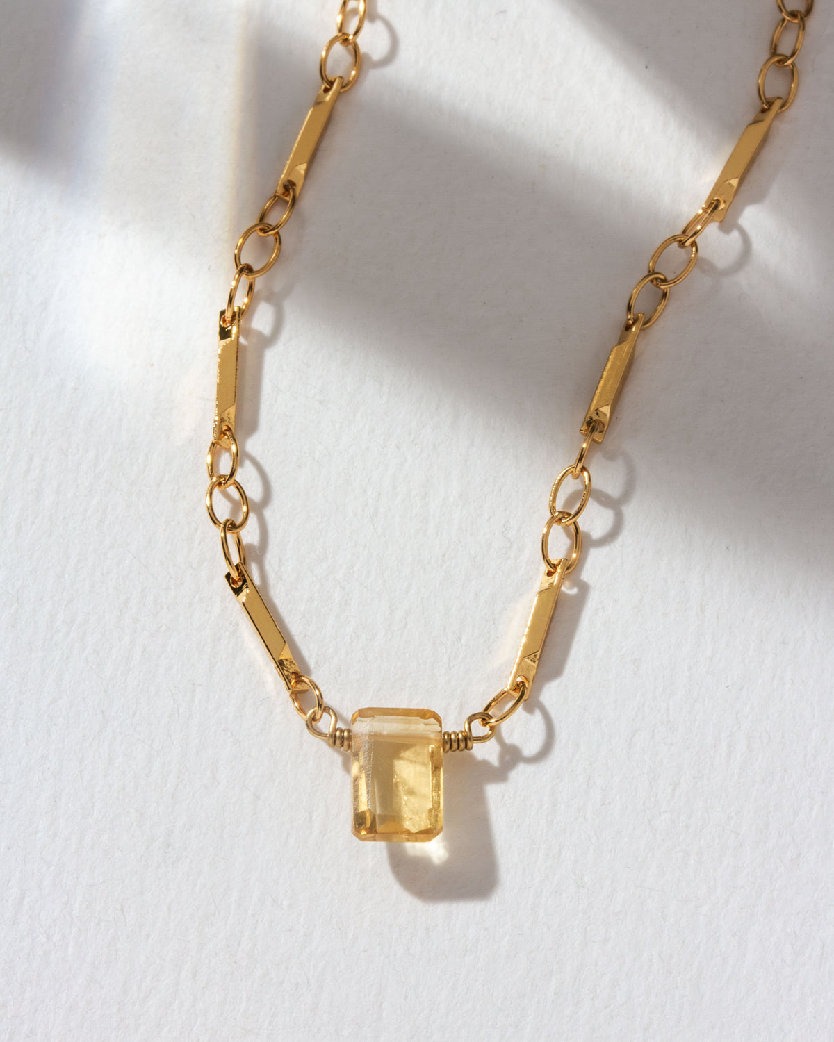 Gold chain necklace featuring a Citrine gemstone pendant.