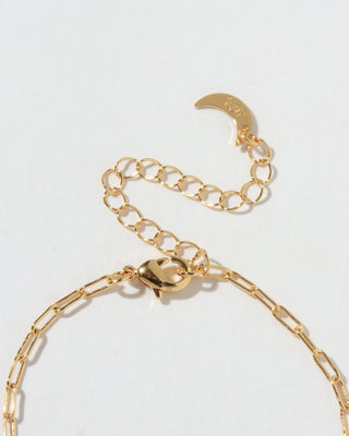 Detail of gold chain lobster closure with gold moon charm