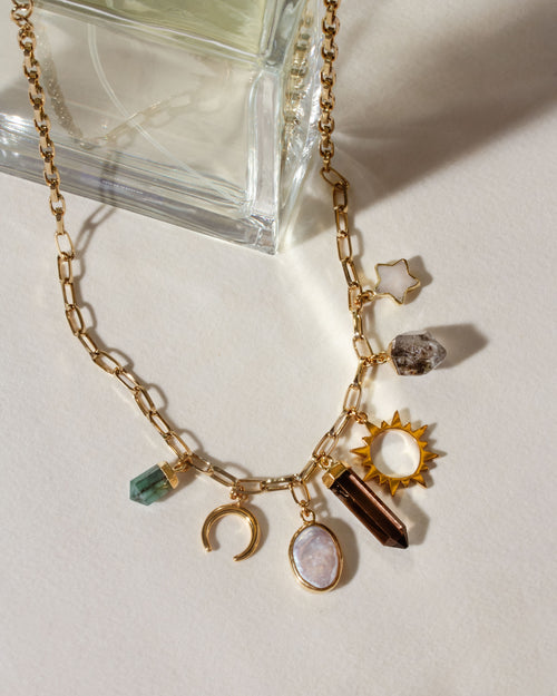 Earthly Treasures necklace with pearl, emerald, smoky quartz, Herkimer quartz, and moonstone charms