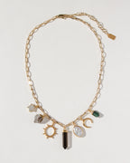 Earthly Treasures necklace featuring gemstone charms on a gold paperclip chain.