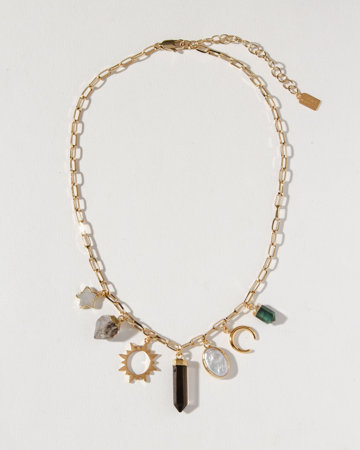 Earthly Treasures necklace featuring gemstone charms on a gold paperclip chain.