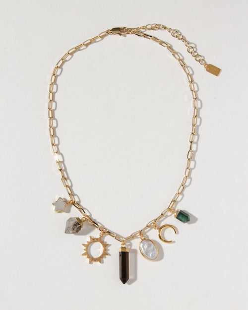 Earthly Treasures necklace featuring gemstone charms on a gold paperclip chain.