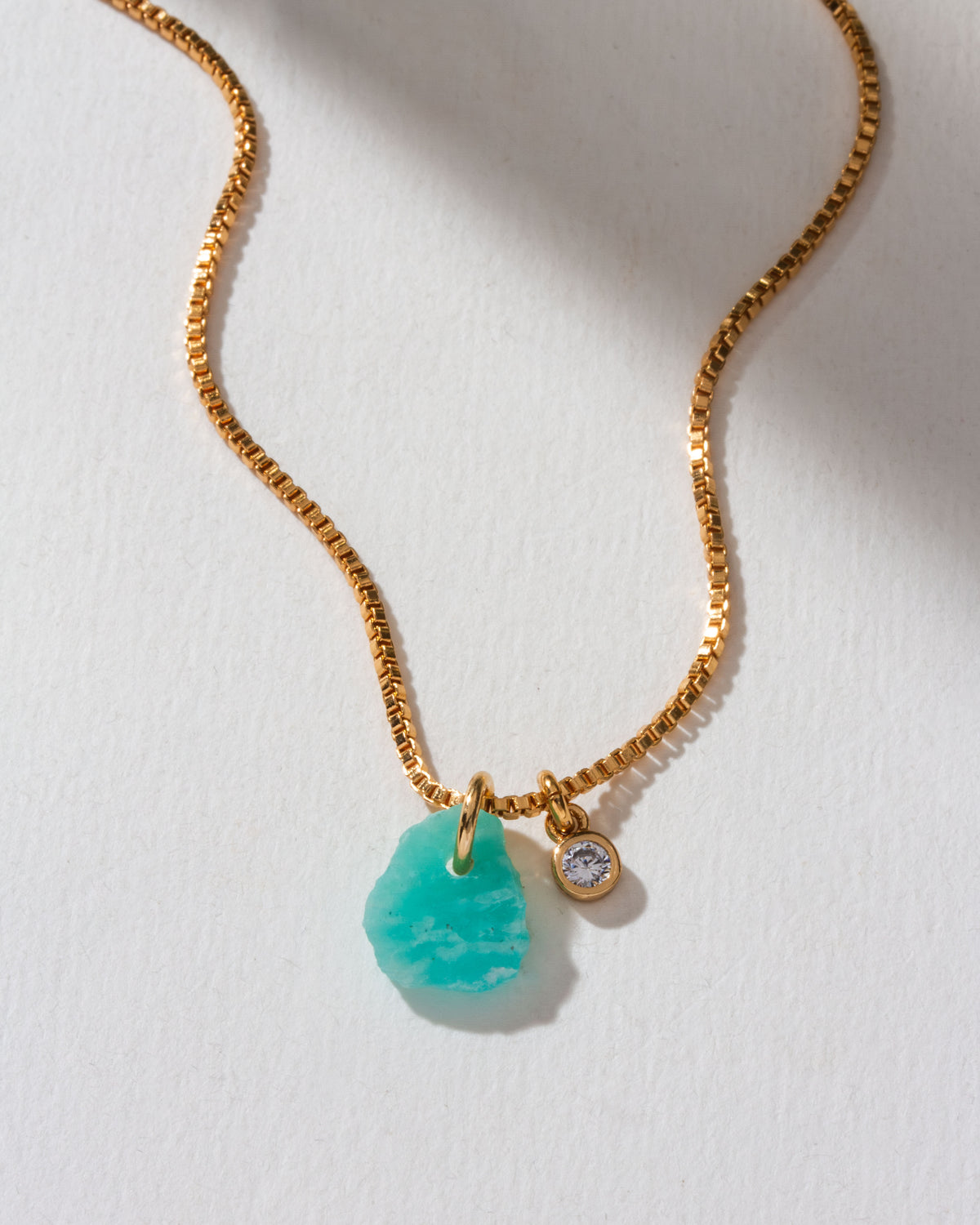 Untamed Gemstone Box Chain Necklace with an Amazonite gemstone and CZ charm on a gold chain.