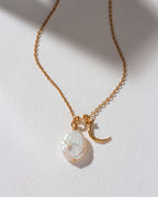 Gold necklace with Freshwater Pearl and crescent moon charm.