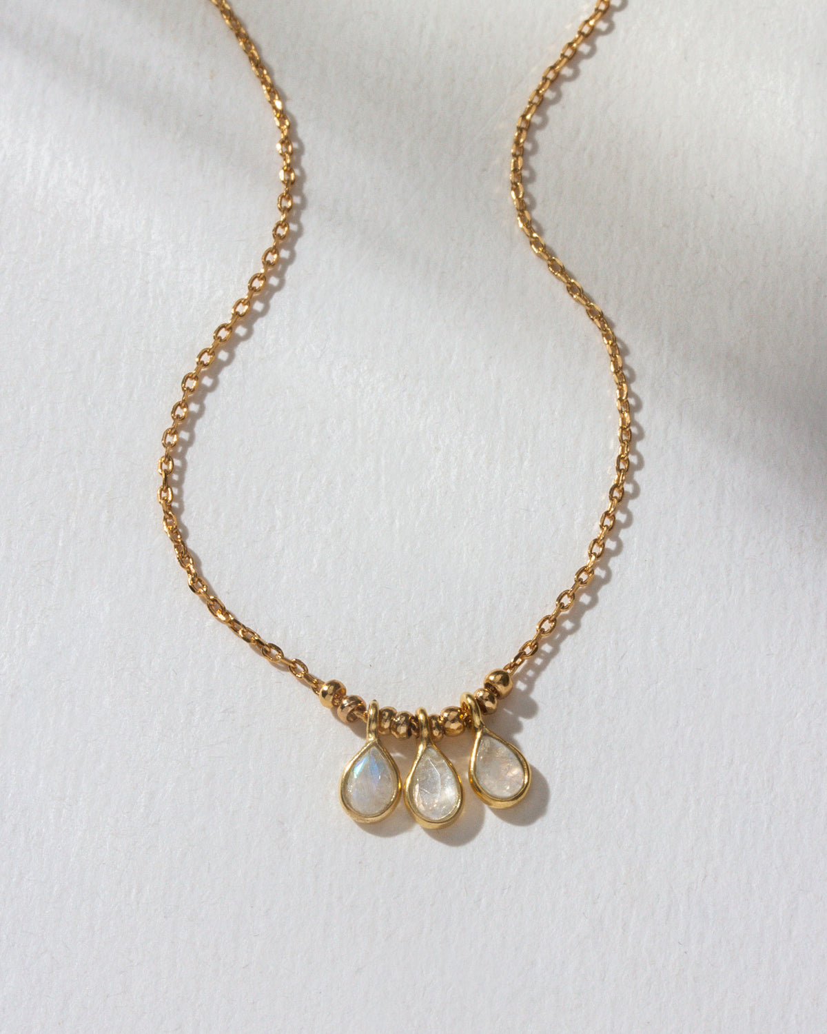 Gold Misty Necklace with three Moonstone pendants.