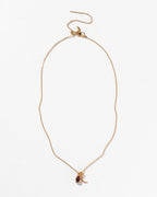 Gold chain necklace with a Watermelon Tourmaline gemstone and crescent moon charm.