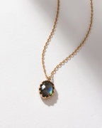 Neptune's Orbit Pendant Necklace with a faceted labradorite gem on an adjustable length gold chain.