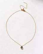 Gold Neptune's Orbit Pendant Necklace featuring a labradorite gem.