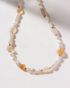Necklace featuring lustrous freshwater pearls interspersed with iridescent opal beads.