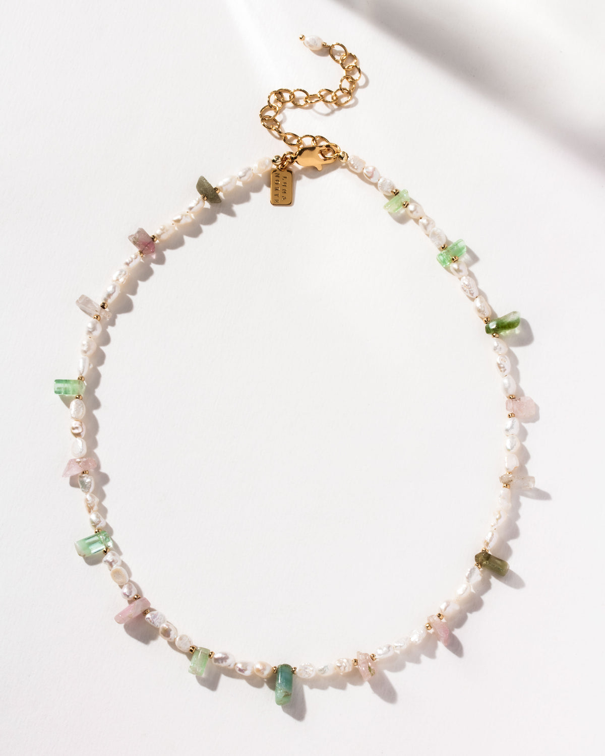 Necklace with watermelon tourmaline stones and freshwater pearls.