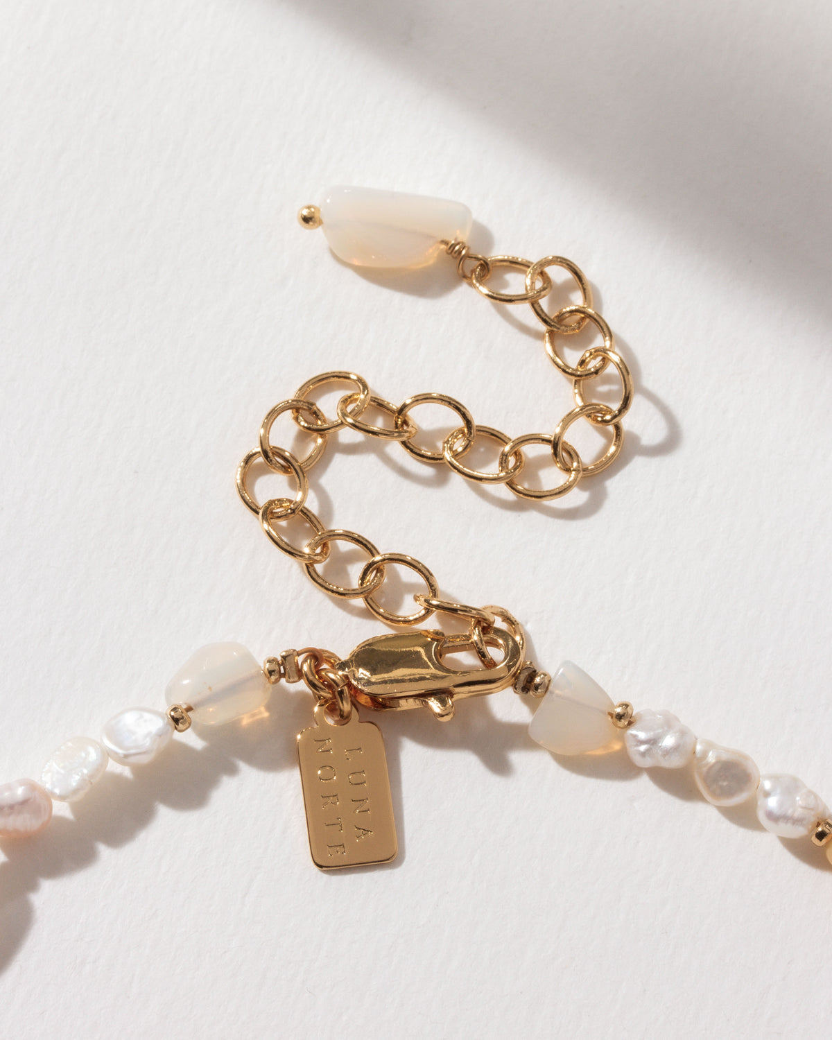 Close up of the Perfect Pairing Opal and Pearl Beaded Necklace clasp and extender.