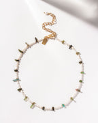 Pearl beaded necklace with watermelon tourmaline stones and gold clasp, in light coloring.