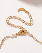 Gold-plated necklace clasp with rose quartz beads and Luna Norte-stamped crescent charm